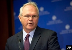 FILE - Former U.S. Ambassador to Iraq Christopher Hill speaks in Washington, Aug. 8, 2010.