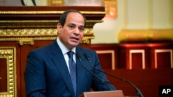 FILE - This photo provided by Egypt’s presidency media office, Egyptian President Abdel-Fattah el-Sissi addresses the chamber after he was sworn in for a second four-year term on June 2, 2018 in Cairo. 