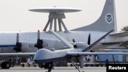 FILE - A Predator B unmanned aircraft at the Naval Air Station in Corpus Christi, Texas, Nov. 8, 2011.