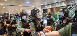 Hong Kong riot police on patrol during protest against National Anthem law, May 27, 2020.