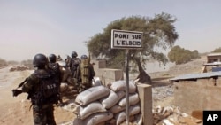 FILE - Cameroon soldiers stand guard at a lookout post as they take part in operations against Boko Haram in Cameroon. 