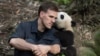 Jake Owens and Qian Qian at the Chengdu Panda Base in China. (Warner Bros./ IMAX Photo)