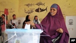 A woman casts her vote in the presidential election in Hargeisa, in the semi-autonomous region of Somaliland, Nov. 13, 2017.
