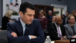 Food and Drug Administration (FDA) Commissioner Scott Gottleib looks over his notes before a House subcommittee hearing on the FDA's Status of Operations, Feb. 27, 2019, on Capitol Hill in Washington.