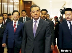 FILE - China's Foreign Minister Wang Yi arrives at a meeting.