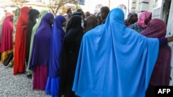 FILE - People wait in a line to cast their votes in the Presidential election at a polling station in Hargeisa, Somaliland, Nov. 13, 2017.