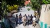 Security forces investigate the perimeters of the residence of Haitian President Jovenel Moise, in Port-au-Prince, Haiti, July 7, 2021. Gunmen assassinated Moise and wounded his wife in their home early Wednesday. 