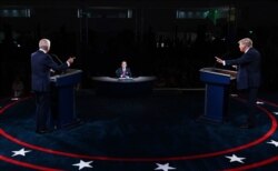FILE - President Donald Trump and Democratic presidential candidate Joe Biden participate in the first presidential debate, Sept. 29, 2020, at Case Western Reserve University and Cleveland Clinic, in Cleveland.