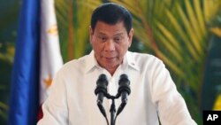 Philippine President Rodrigo Duterte speaks at a news conference prior to boarding his flight for a three-day official visit to Japan at the Ninoy Aquino International Airport in suburban Pasay City, south of Manila, Philippines, Oct. 25, 2016.