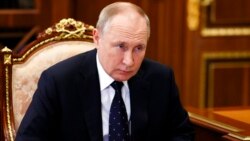 In this Jan. 18, 2022, photo, Russian President Vladimir Putin listens during a meeting in the Kremlin, in Moscow, Russia.