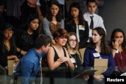 Students from Marjory Stoneman Douglas High School and those supporting them react, Feb. 20, 2018.
