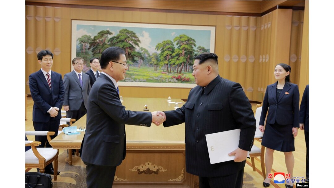 FILE - North Korean leader Kim Jong Un shakes hands with Chung Eui-yong, who led a special delegation of South Korea's president, in this photo released by North Korea's Korean Central News Agency, March 6, 2018.