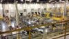 Robots Boost Productivity, But Humans Still Needed on the Job, Report Says