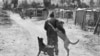 One of O’Brien’s favorite photographs, of a man with his loving dogs in Hopefield township near Johannesburg (Photo: E. O’Brien Photography)