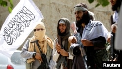 Taliban celebrate ceasefire in Ghanikhel district of Nangarhar province, Afghanistan, June 16, 2018.