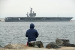 FILE - Aircraft carrier USS Nimitz departs for the Western Pacific from San Diego, California, June 5, 2017.