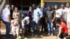 People lay flowers and pay their respects where constitutional law expert Gilles Cistac was murdered on March 3, 2015 in Maputo, Mozambique.