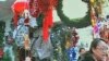 Brightly-colored lights of the season are attracting a growing number of Chinese fans, who say they like the idea of decorating and giving gifts, December 2011.