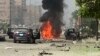 Black smoke billows from a burning car moments after a bomb attack targeted the convoy of Egypt's Interior Minister Mohammed Ibrahim, in Nasr City, Egypt, Sept. 5, 2013 (AP Photo File)