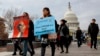 FILE - People march in support of the Deferred Action for Childhood Arrivals (DACA) and Temporary Protected Status (TPS) programs, Dec. 5, 2017, on Capitol Hill in Washington. 