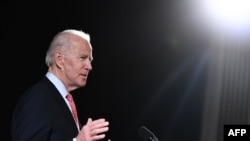 FILE - In this photo taken on March 12, 2020 former US Vice President and Democratic presidential hopeful Joe Biden speaks about COVID-19, during a press event in Wilmington, Delaware. 