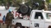 FILE - U.N. peacekeepers take a break as they patrol along a street during presidential elections in Bangui, the capital of the Central African Republic, Dec. 30, 2015. 