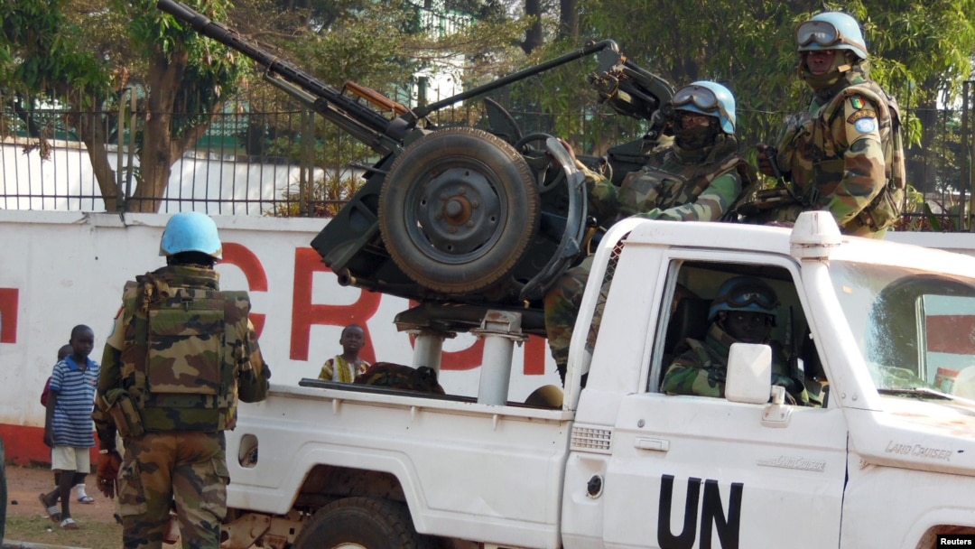 FILE - U.N. peacekeepers take a break as they patrol along a street during the presidential election in Bangui, the capital of Central African Republic, Dec. 30, 2015. 