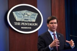 FILE - Defense Secretary Mark Esper speaks during a news conference at the Pentagon in Washington, Dec. 20, 2019.
