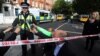 FILE - Deputy Chief Constable Adrian Hanstock of the British Transport Police makes a statement to the media after an incident at Parsons Green underground station in London, Britain, Sept. 15, 2017. 