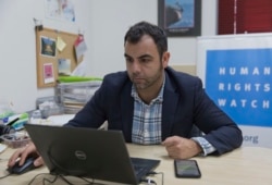 Omar Shakir, the local director of Human Rights Watch, works at his office in the West Bank city of Ramallah, Nov. 5, 2019.