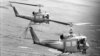 FILE - Soldiers of the U.S. 25th Infantry Division dangle their feet over the sides as they are transported by helicopter into an operational area in the Mekong Delta southwest of Saigon, Aug. 9, 1967. The unit was on a search and clear operation. 