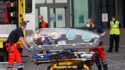 FILE - German army emergency personnel load into their ambulance the stretcher that was used to transport Russian opposition figure Alexei Navalny on at Berlin's Charite hospital, Aug. 22, 2020.