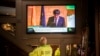 People in a bar watch the speech of Catalan regional president Carles Puigdemont on television in Barcelona, Spain, Oct. 26, 2017.
