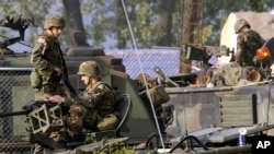 FILE - U.S. Army soldiers stand guard at their base in South Korea, Oct. 6, 2004. A U.S. military base in South Korea accidentally blared an alert siren, causing a brief scare as the U.S. and its allies monitor for signs of provocation from North Korea.