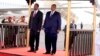 Djibouti President Ismaïl Omar Guelleh, right, welcomes Ethiopian Prime Minister Abiy Ahmed at Ambouli International Airport, April 28, 2018. (T. Muse/VOA)
