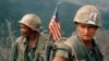 U.S. Marines unload equipment at a landing zone in Vietnam on December 1969. 