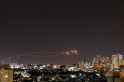 Iron Dome anti-missile system fires interception missiles as rockets are launched from Gaza toward Israel as seen from the city of Ashkelon, Israel, Nov. 1, 2019.