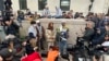 Demonstration leader Khymani James, center right, and other protesters address the media outside a tent camp on the campus of Columbia University in New York on April 24, 2024. 