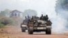 Congolese government troops ride armored vehicles toward the front line, near the eastern city of Goma, Democratic Republic of Congo, July 17, 2013. 