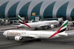 FILE PHOTO: Emirates Airline Boeing 777-300ER planes are seen at Dubai International Airport in Dubai, United Arab Emirates, February 15, 2019. REUTERS/Christopher Pike/File Photo
