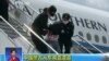 People being deported from Thailand are seen brought off an airplane by police at an unidentified location in China, July 9, 2015, in this still image taken from CCTV video aired on July 11, 2015. CCTV said they were mostly from the country's western Xinjiang region and were attempting to go to Turkey and then to join the Jihad in Syria and Iraq, and 13 of them were terror suspects. 