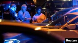 Memphis police officers work at one of multiple crime scenes