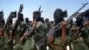 FILE - Islamist fighters loyal to al-Shabab perform military drills at a village in the Lower Shabelle region, 25 kilometers outside Mogadishu, Feb. 17, 2011. 