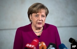 German chancellor Angela Merkel delivers a statement in Berlin, Jan. 7, 2018.