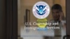 FILE - A security guard looks out of the U.S. Citizenship and Immigration Services offices in New York, Aug. 15, 2012.