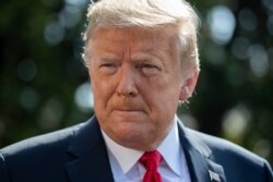 President Donald Trump speaks with reporters before departing on Marine One on the South Lawn of the White House, June 23, 2020, in Washington.