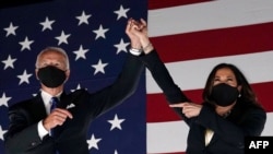 Former vice president and Democratic presidential nominee Joe Biden and Senator from California and Democratic vice presidential nominee Kamala Harris greet supporters outside the Chase Center in Wilmington, Delaware, on Aug. 20, 2020.