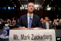 Facebook CEO Mark Zuckerberg arrives to testify before a joint hearing of the Senate Commerce and Judiciary committees on Capitol Hill in Washington, April 10, 2018, about the use of Facebook data to target American voters in the 2016 election.