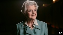 FILE - Angela Lansbury poses for a portrait during press day for "Blithe Spirit" in Los Angeles on Dec. 16, 2014.