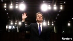 U.S. Supreme Court nominee judge Brett Kavanaugh is sworn in during a Senate Judiciary Committee confirmation hearing on Capitol Hill in Washington, Sept. 4, 2018.